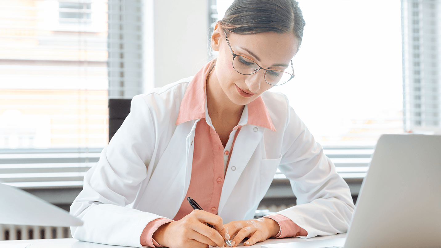 Physician filling out licensure application