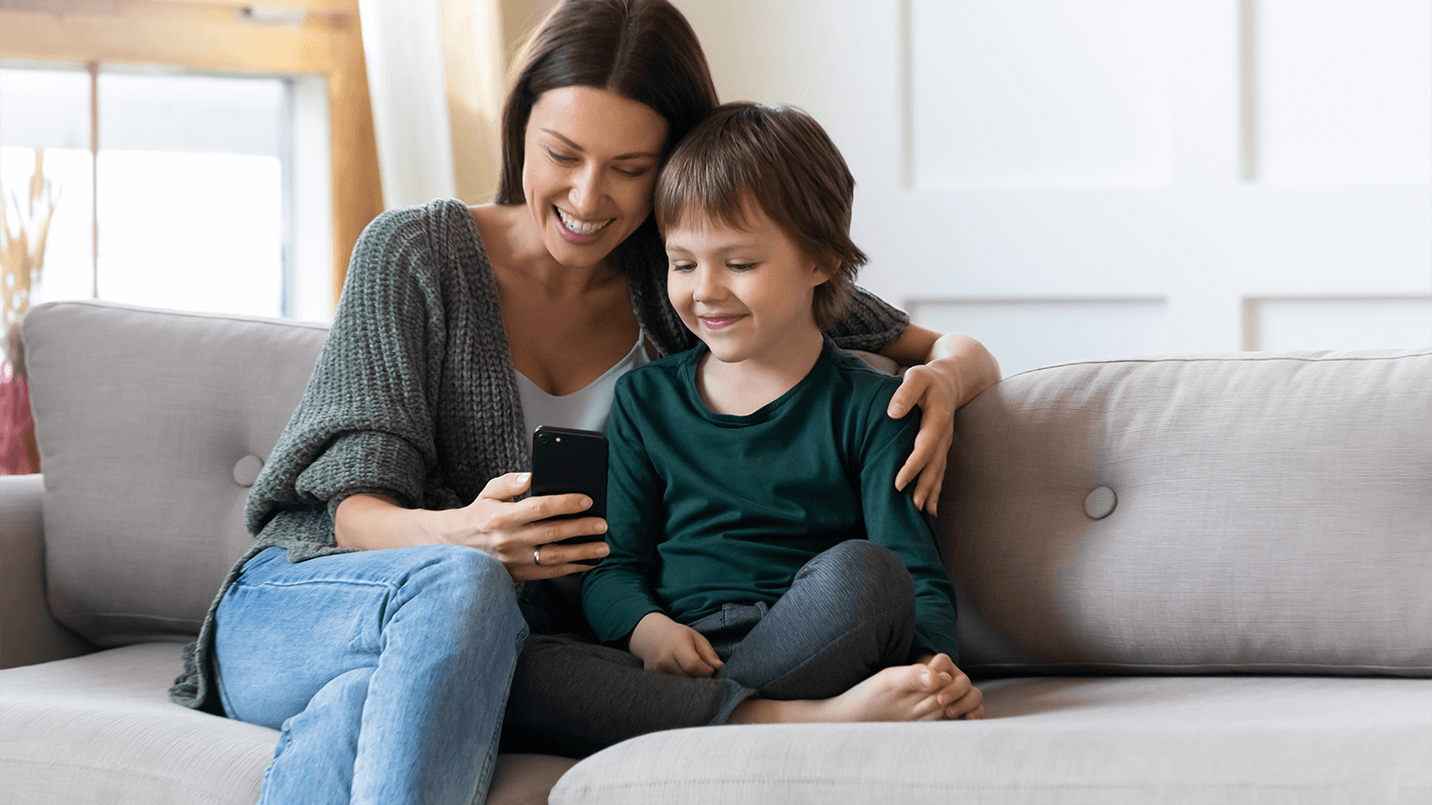 Mom and boy looking at a phone