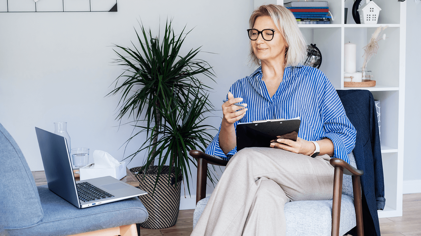 female therapist talking to patient over a video call or telehealth visit