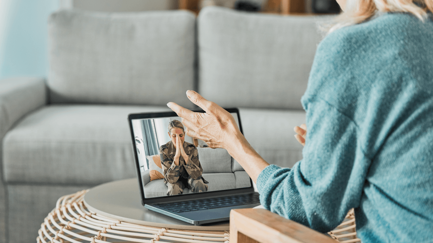 Healthcare-provider-communicating-with-a-female-military-veteran-via-video-call