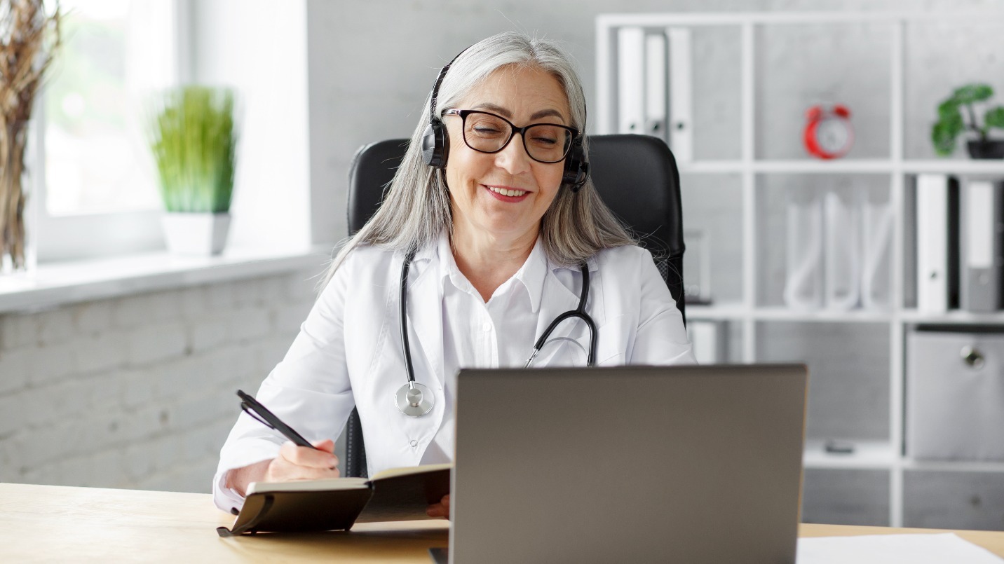 female-doctor-in-her-office-using-laptop-for-video-chat-with-a-patient