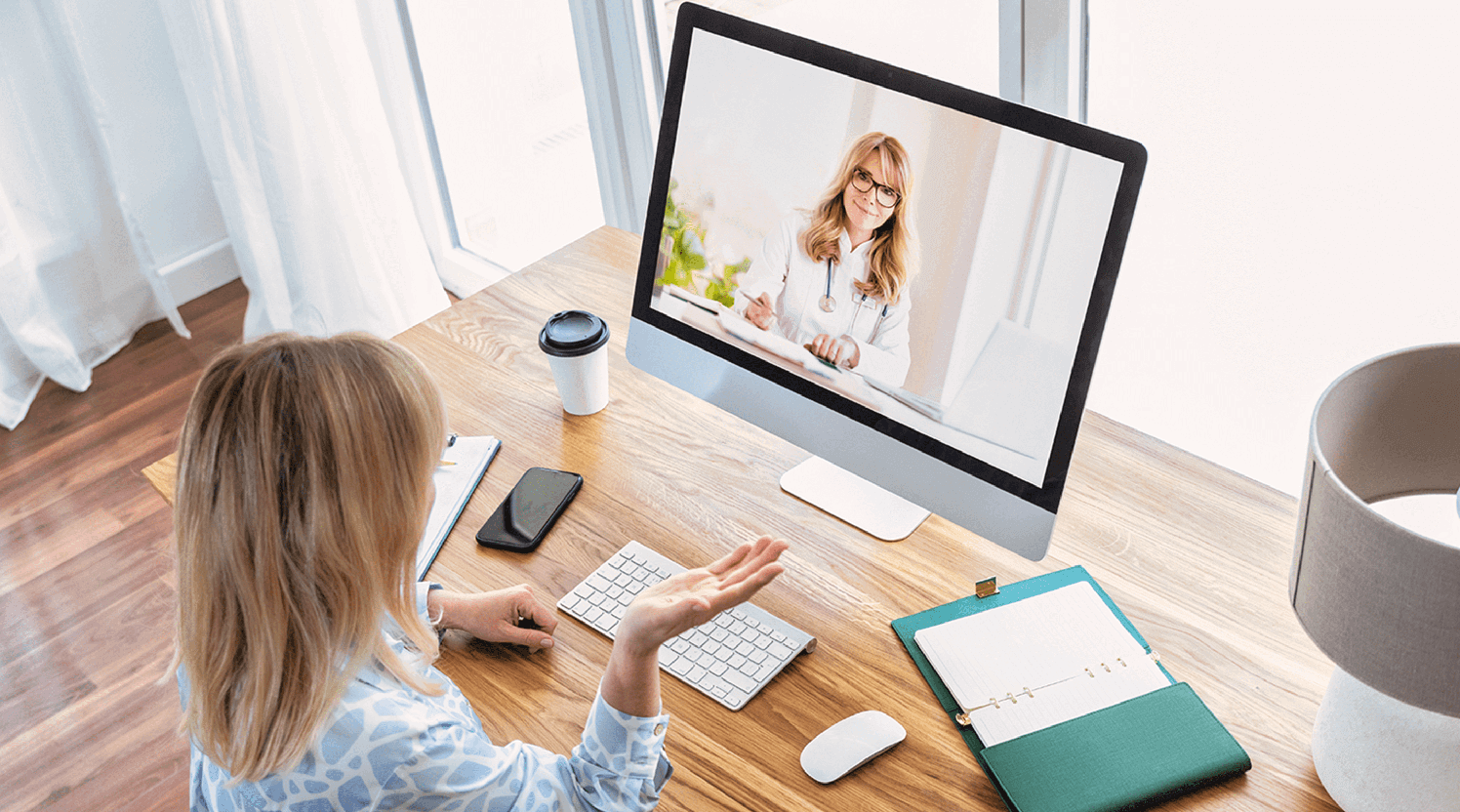 white-woman-talking-to-her-provider-via-telehealth