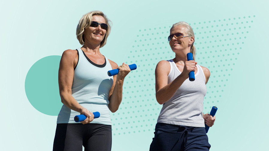 Two healthy, older women feeling energized while walking and holding weights