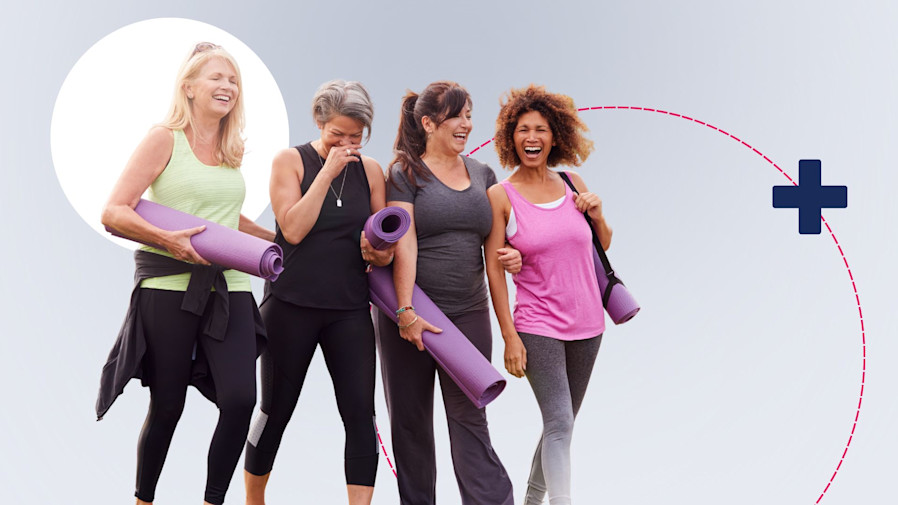 Middle aged women wearing yoga clothing walking and laughing