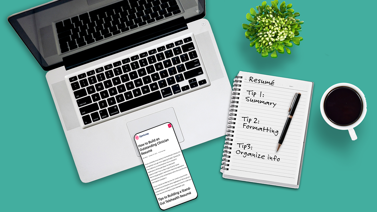 Laptop-cell-phone-plant-coffee-notebook-and-pen