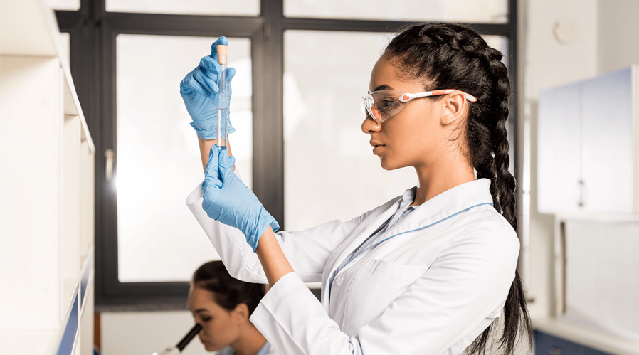 female-lab-assistant-holding-pipette