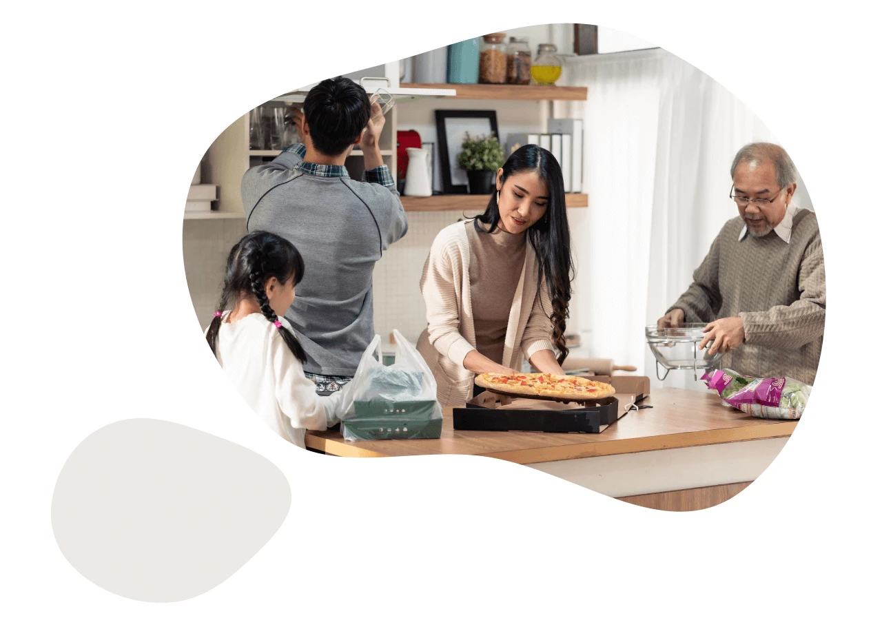 A photo of an Asian American family of multiple generations, making dinner. 