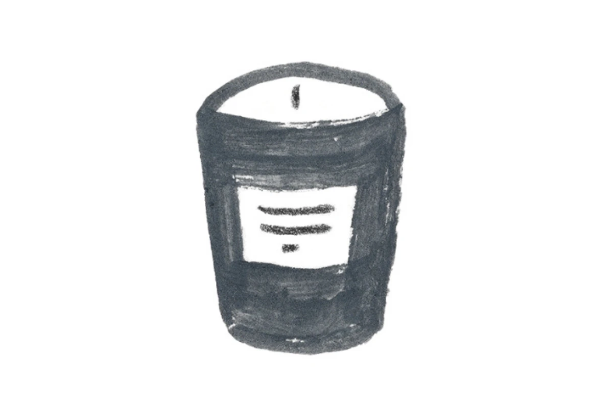 A Monarch by SimplePractice illustration of a black candle with a white label and white wax.