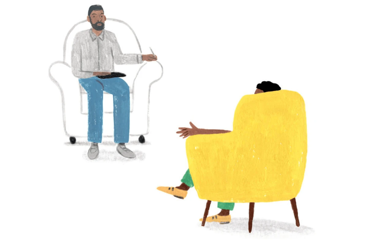 A Monarch by SimplePractice illustration of a therapist wearing a gray shirt and blue pants sitting in a white chair facing a client sitting in a yellow chair.
