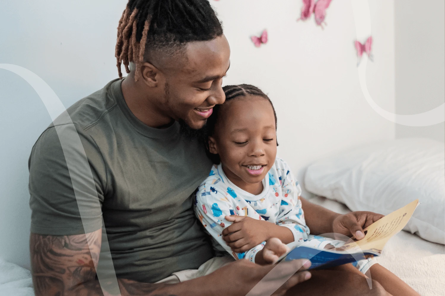 A dad reads a book about mental health for kids about recognizing difficult emotions to his daughter.