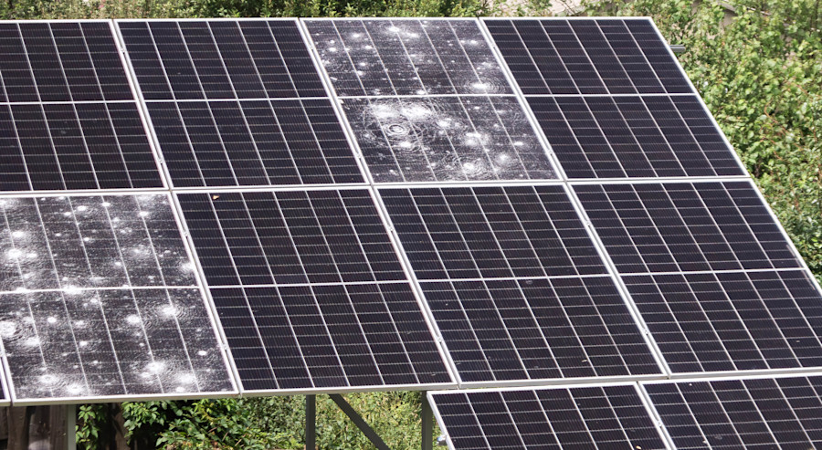 image of solar panels damaged by hailstones