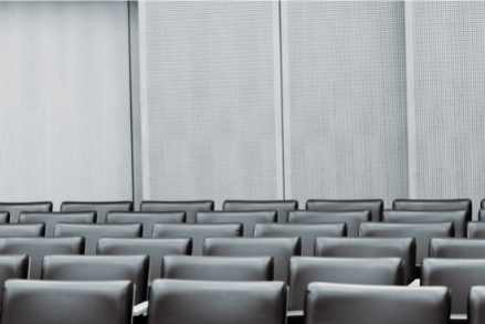 Rows of seats in a courtroom.