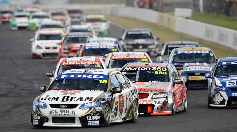 V8 supercars racing around a race track.