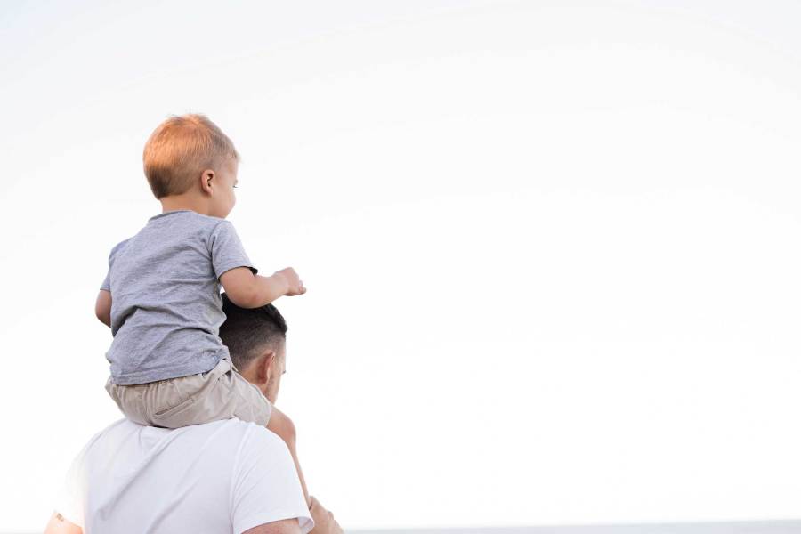 Young child on father's shoulders