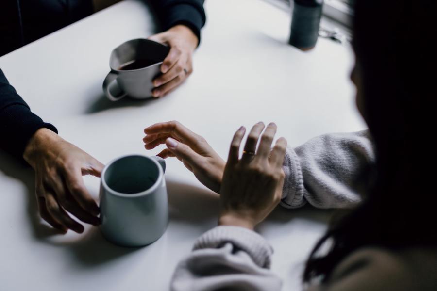 Two people sharing a coffee.