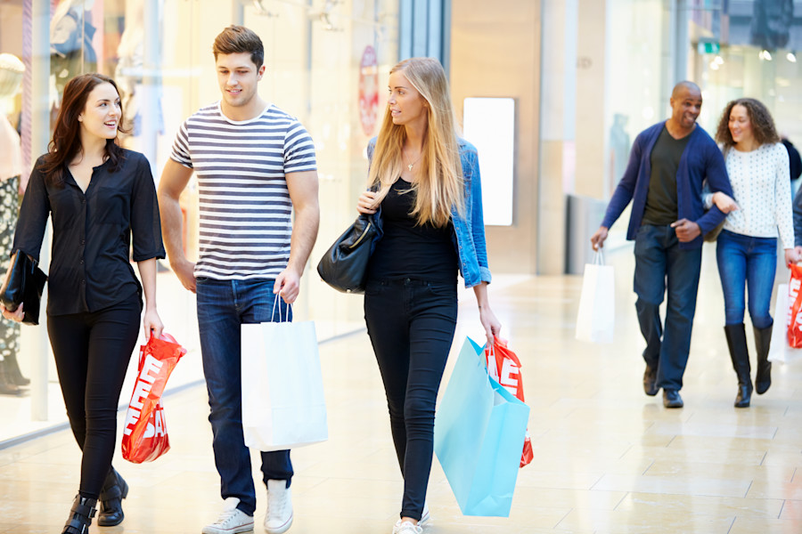 Interior of shopping mall and people shopping