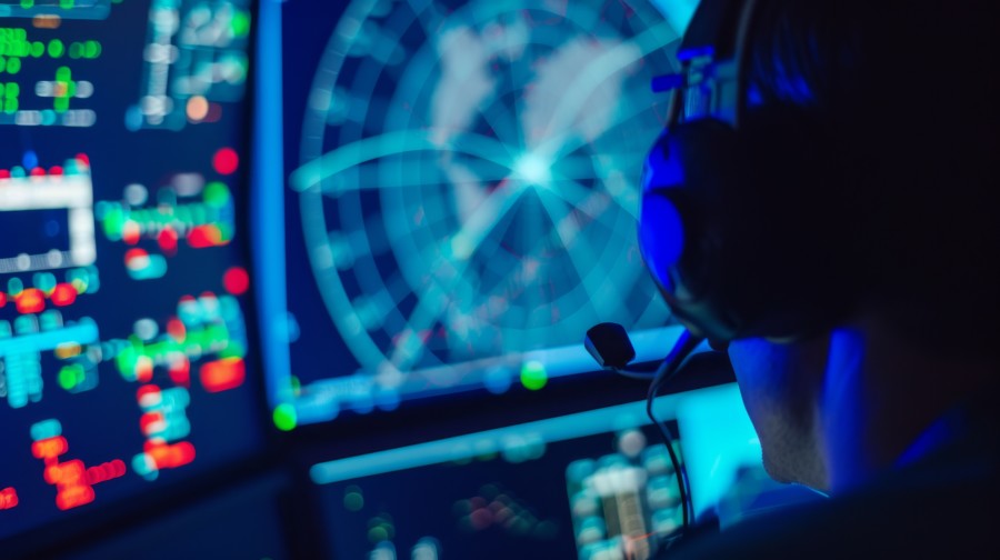 A man working at a digital console. 