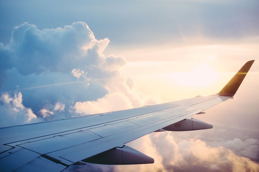 The wing of an aeroplane as it flies through the clouds.