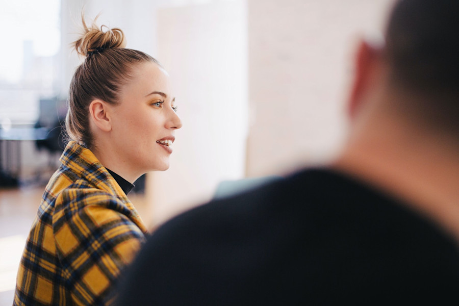 Woman speaking in a meeting.