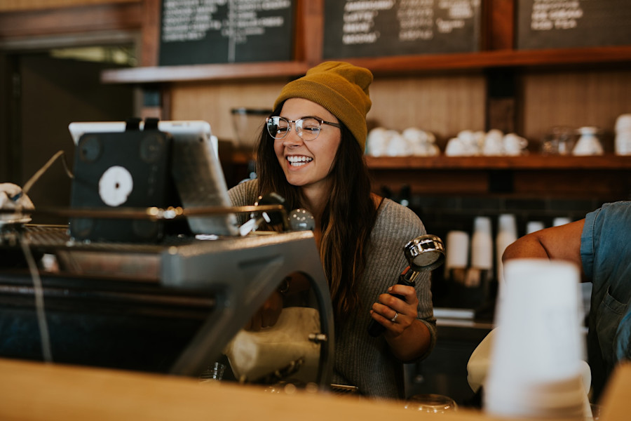 Woman working in a coffee shop.