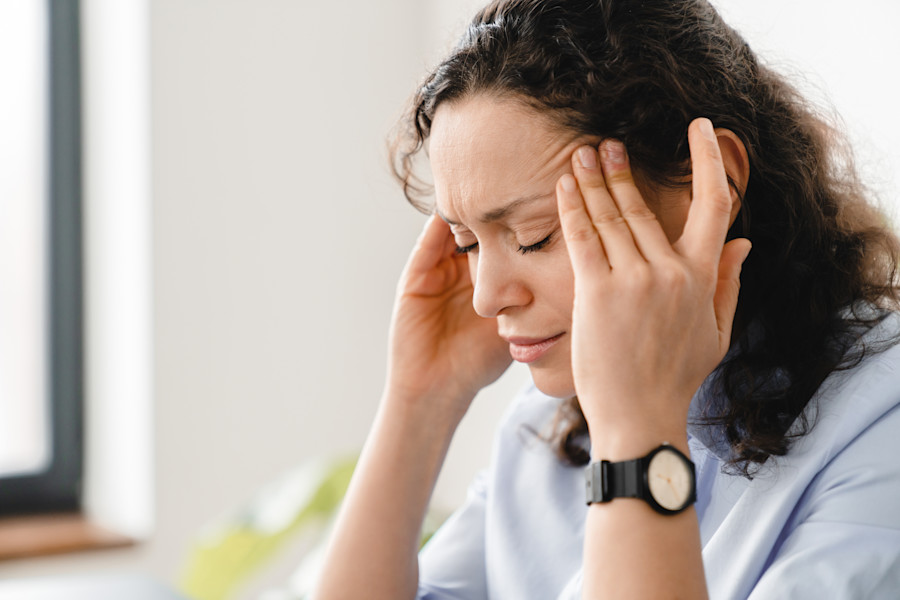 Image of female in the workplace looking uncomfortable