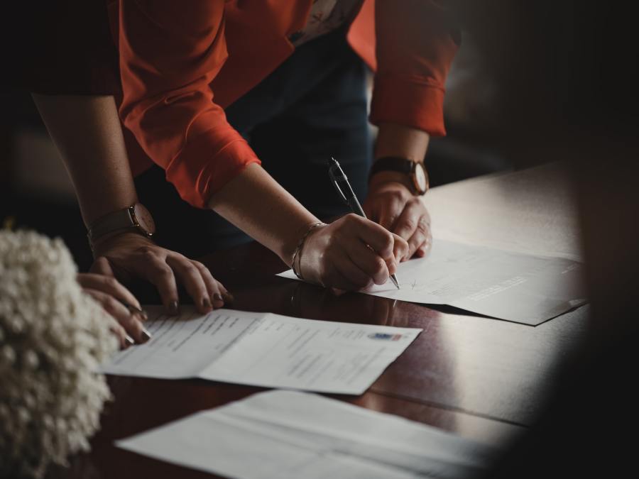 Picture of woman signing contract