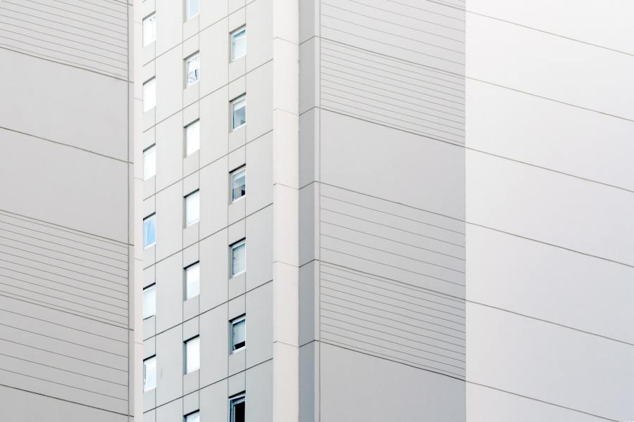 Close-up on the exterior cladding of a high-rise residential building.