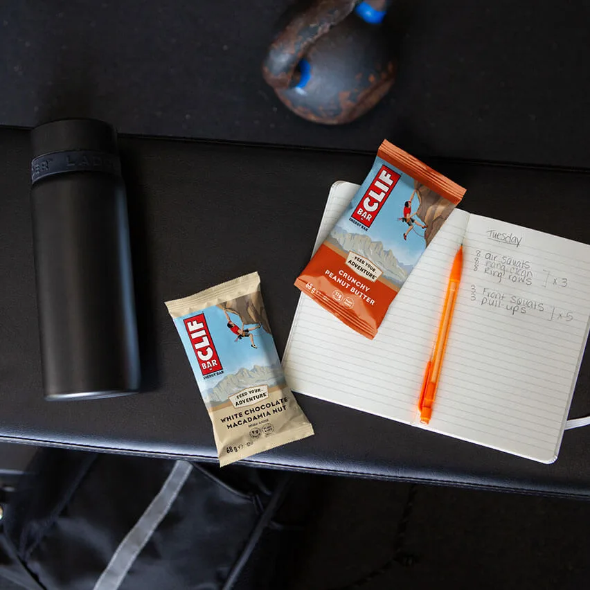 CLIF-BAR-White-Chocolate-Macadamia-Nut-and-Crunchy-Peanut-Butter-at-the-gym-before-workout-listing-EU compressed