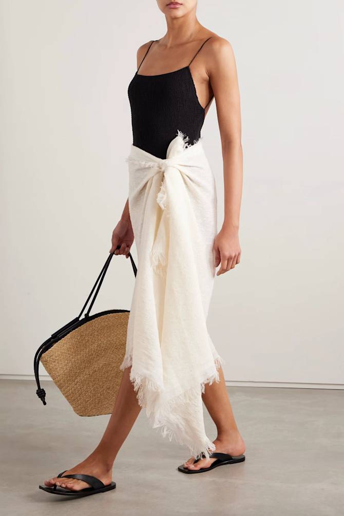 beach outfit, black swimsuit with a white sarong