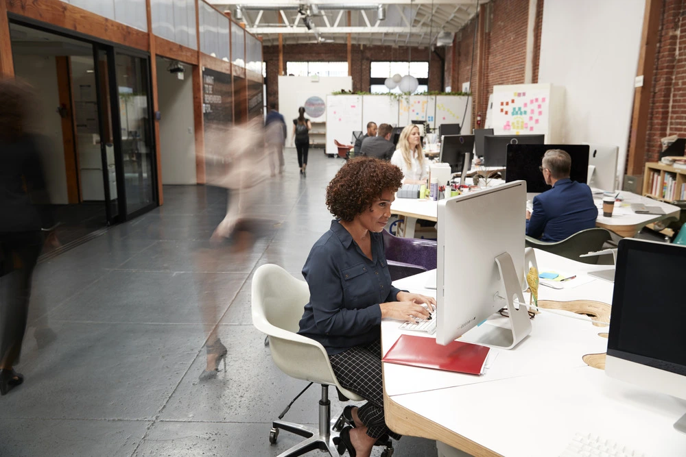 business-team-working-at-desks-in-modern-open-plan