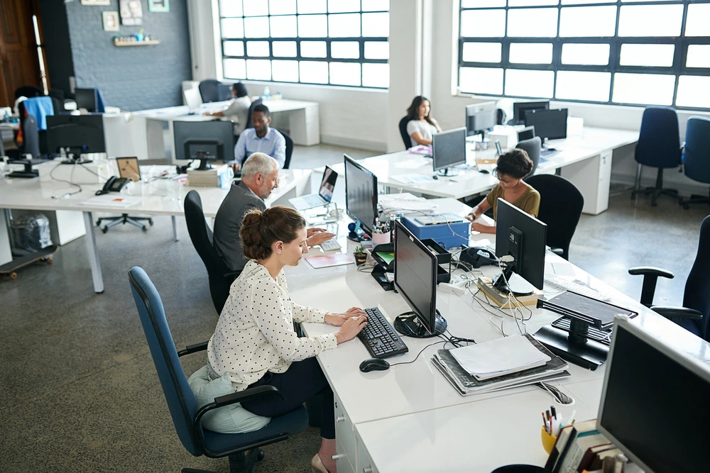 shot-of-a-group-of-coworkers-sitting-at-their-work