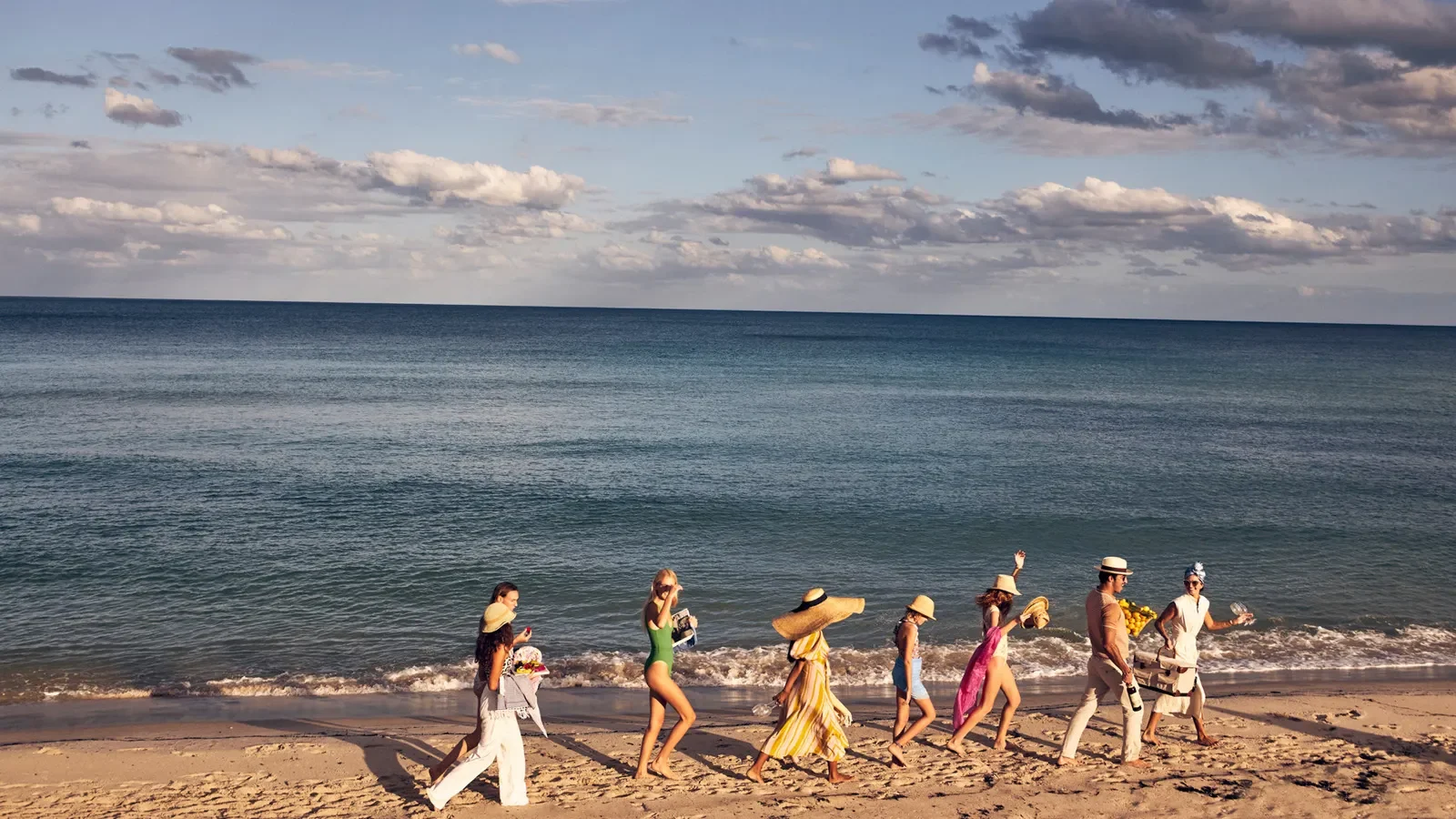 Group of people walking on the beach