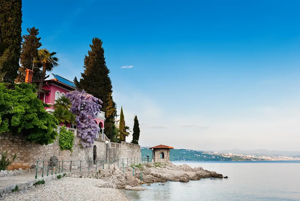 A waterside village with cypress trees on the Adriatic