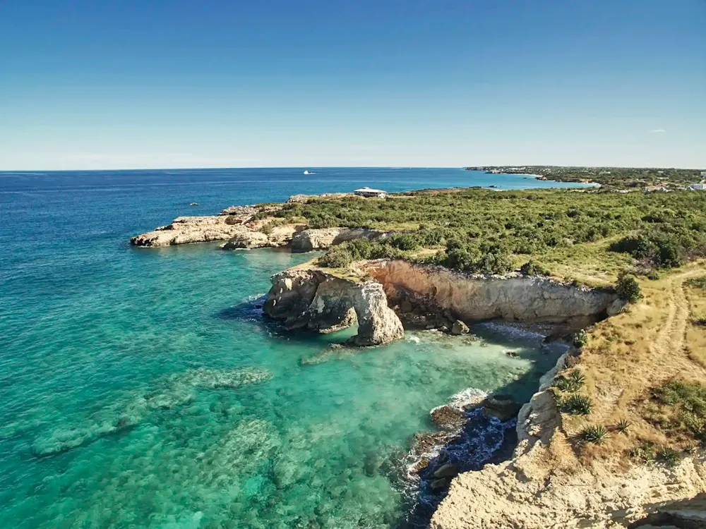 Clear water and low cliffs on the coast of Anguilla