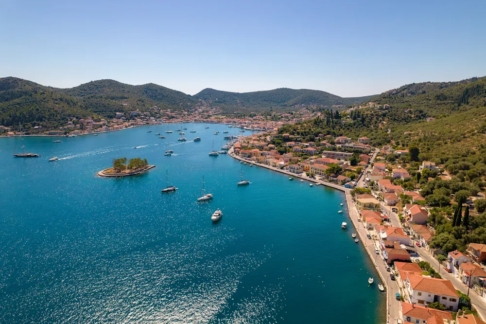 A Greek island harbour with boats at anchor