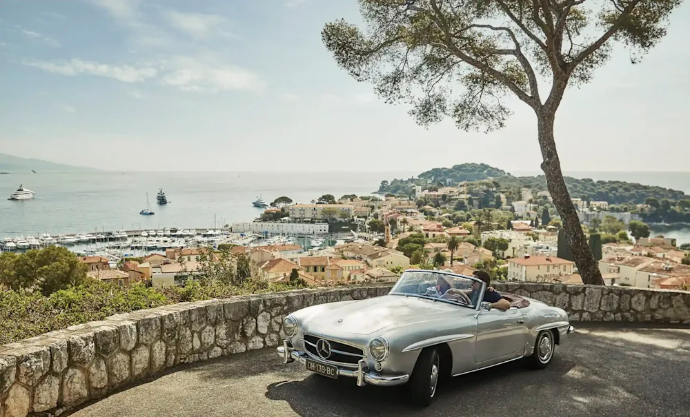 A classic car on a coastal road above Saint-Jean-Cap-Ferrat