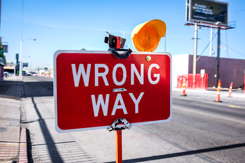 A road sign indicating a driver is going the wrong way