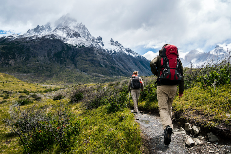 A man hiking up a mountain