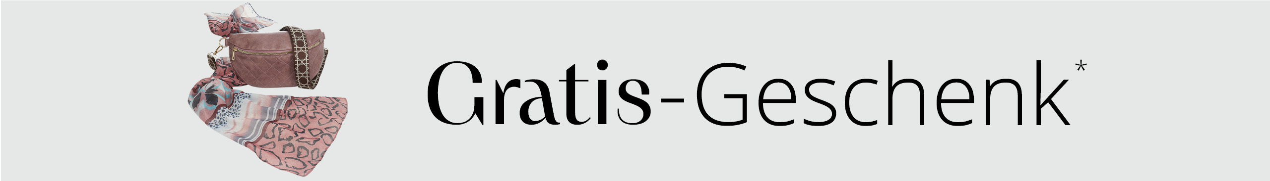 Eine rosa Bauchtasche und ein gemustertes Tuch sind nebeneinander vor weißem Hintergrund arrangiert. Darüber steht 'Gratis-Geschenk'