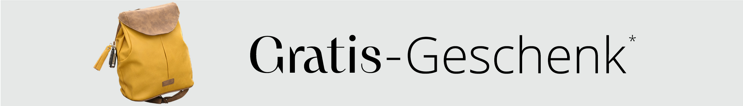 Ein gelber Rucksack mit braunem Klappdeckel und Quastenanhänger wird neben dem Text Gratis Geschenk abgebildet.