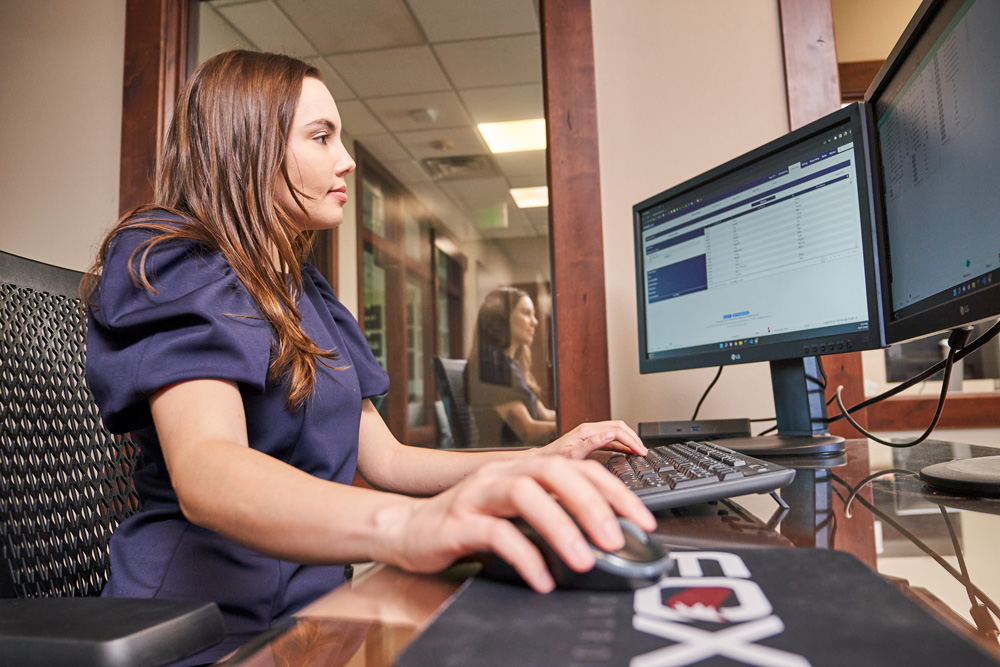 Woman Looking At Monitors
