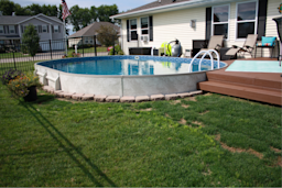 above ground swimming pool in backyard