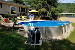 above ground swimming pool in backyard