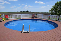 above ground swimming pool with wooden deck