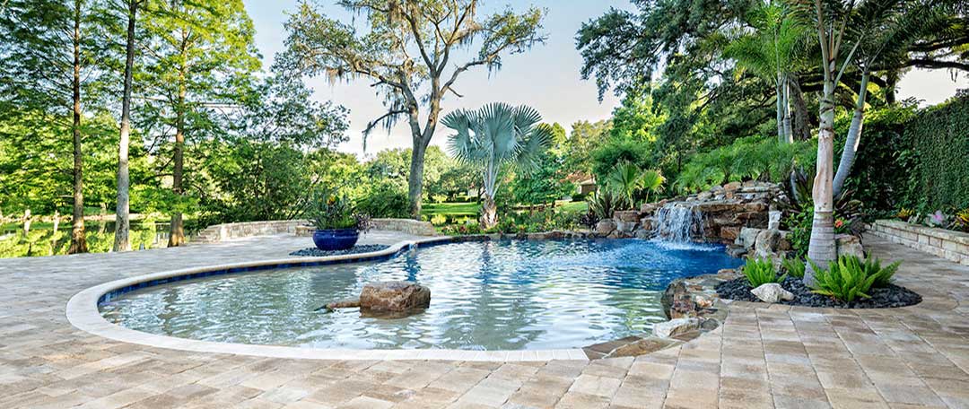 pool-with-stone-pavers-and-waterfall