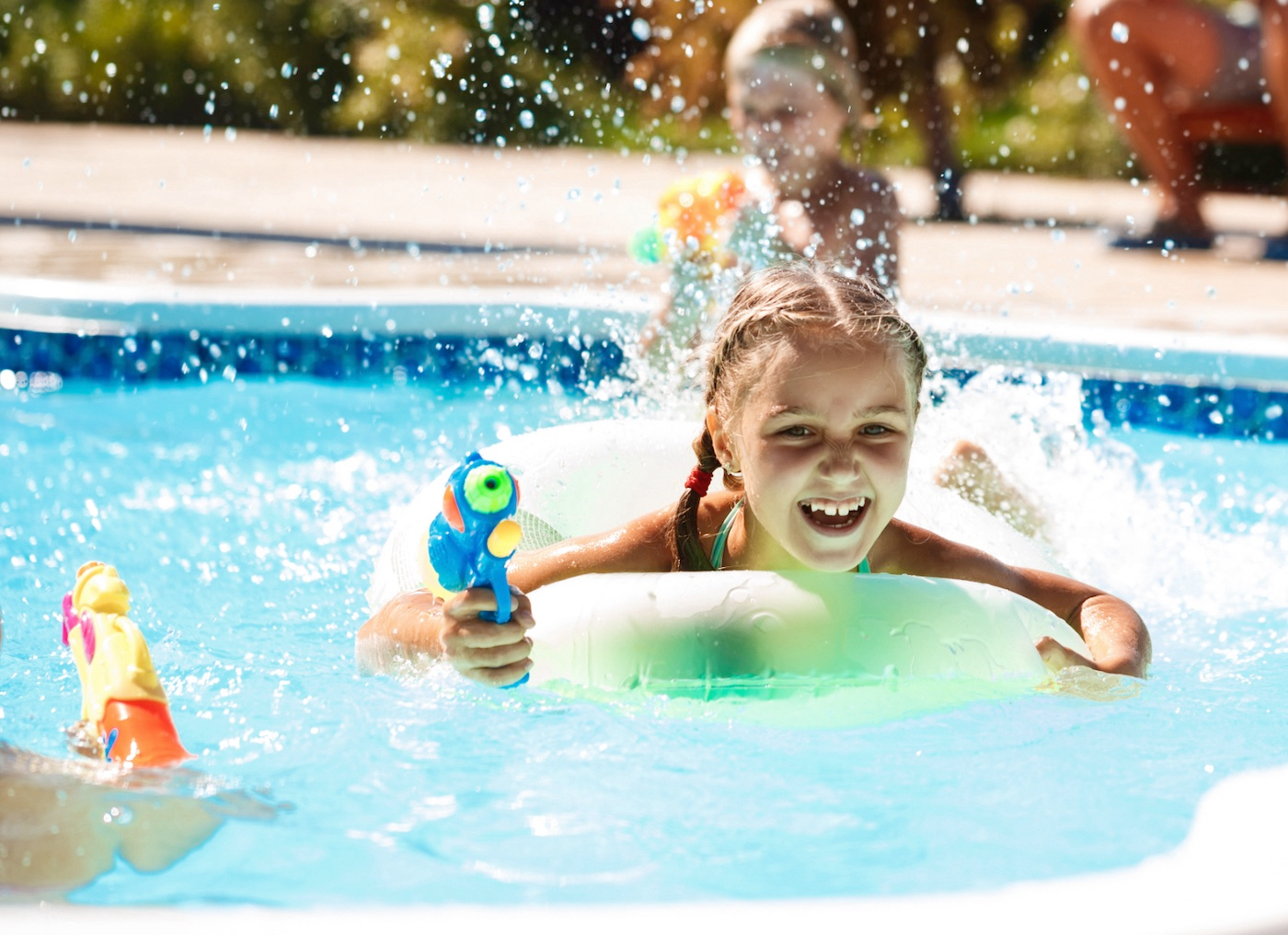 girl playing in swimming pool