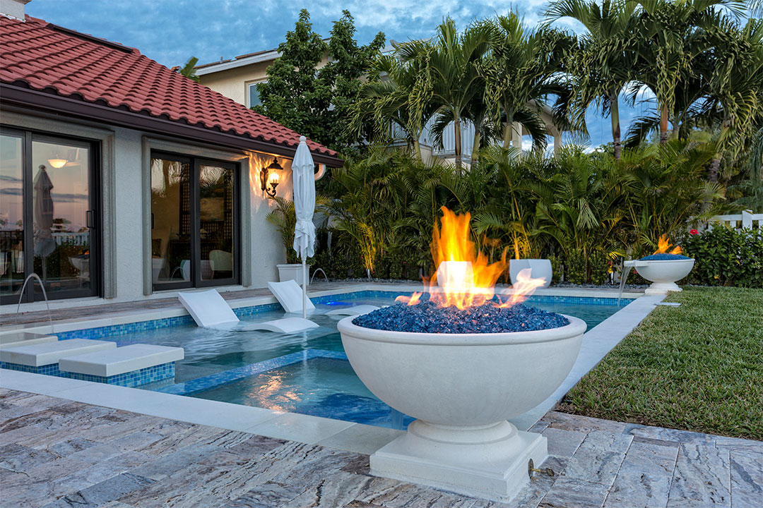 pool-with-fire-feature-at-dusk