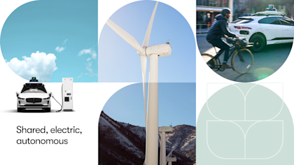A modern collage evoking clean and sustainable imagery, including white clouds in a blue sky, a wind turbine in the mountains, a Waymo vehicle charging, and another Waymo vehicle sharing the road with a cyclist.   