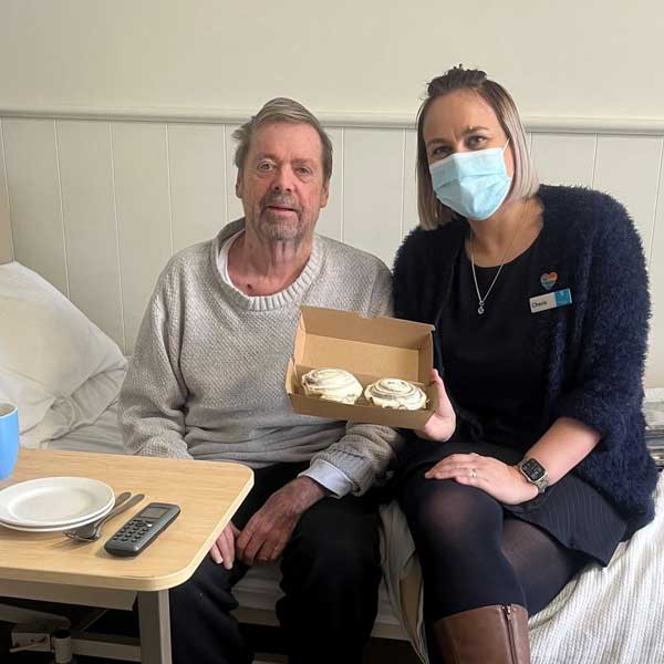 Larry and Cherie enjoying cinnamon scrolls from local bakery near Bupa Caulfield