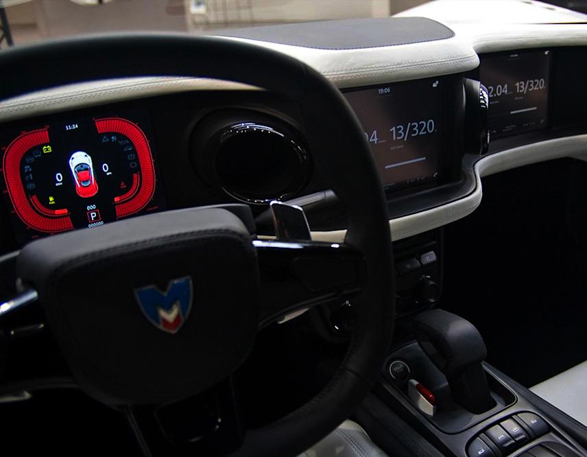 photograph of the marussia sports car interior featuring a dashboard interface